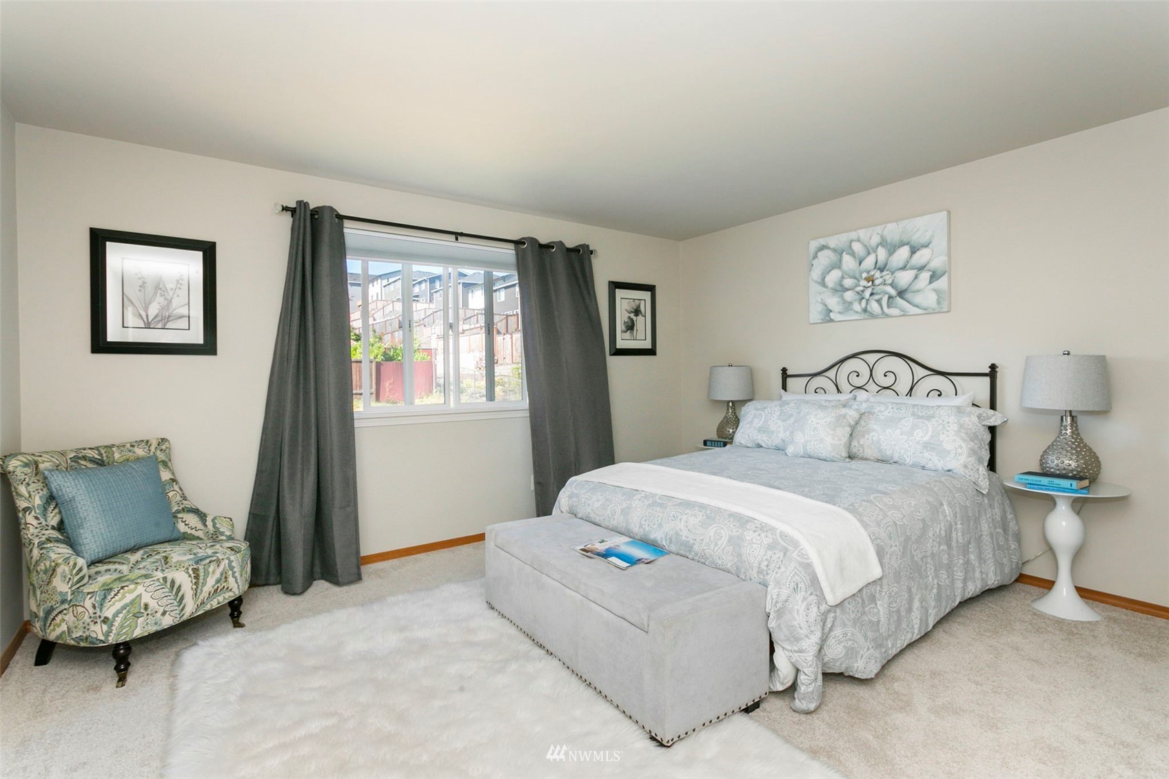 18487 Rainier View Road Southeast Monroe, WA 98272 - Photo 7 of 19 a bedroom with a bed and a couch