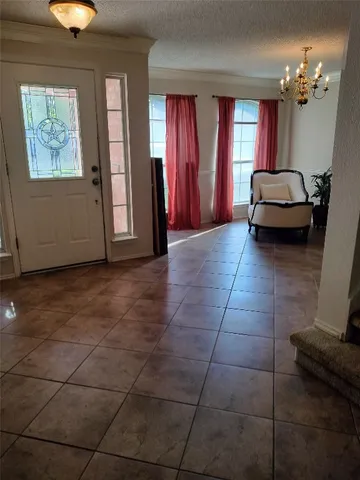 a view of a livingroom with furniture and window