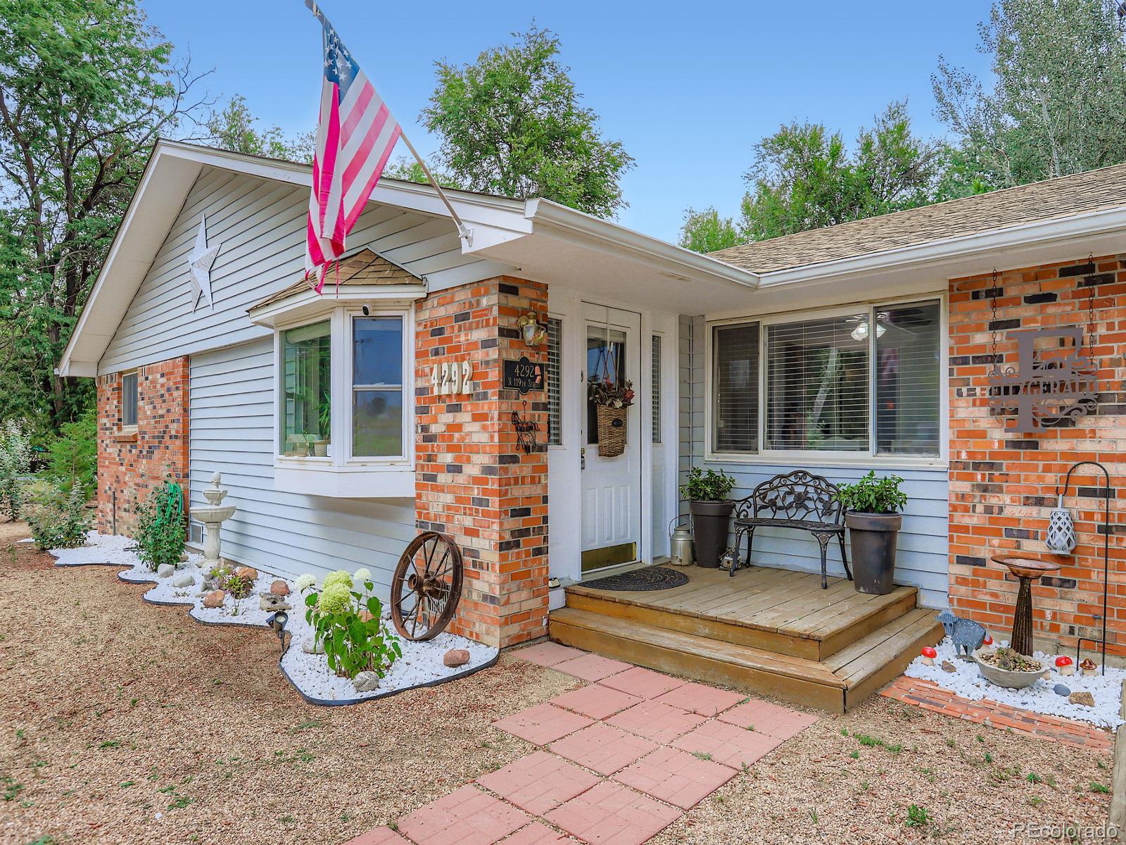 4292 North 119th Street Erie, CO 80516 - Photo 1 of 30 a view of a chairs and table in the patio