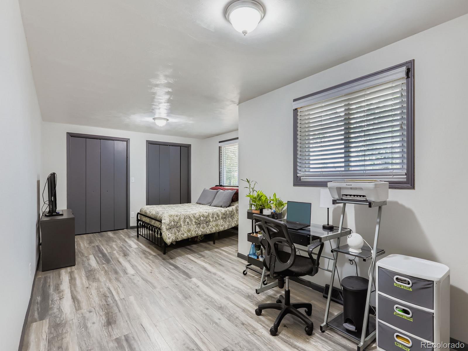 4292 North 119th Street Erie, CO 80516 - Photo 16 of 30 a bedroom with furniture and a window
