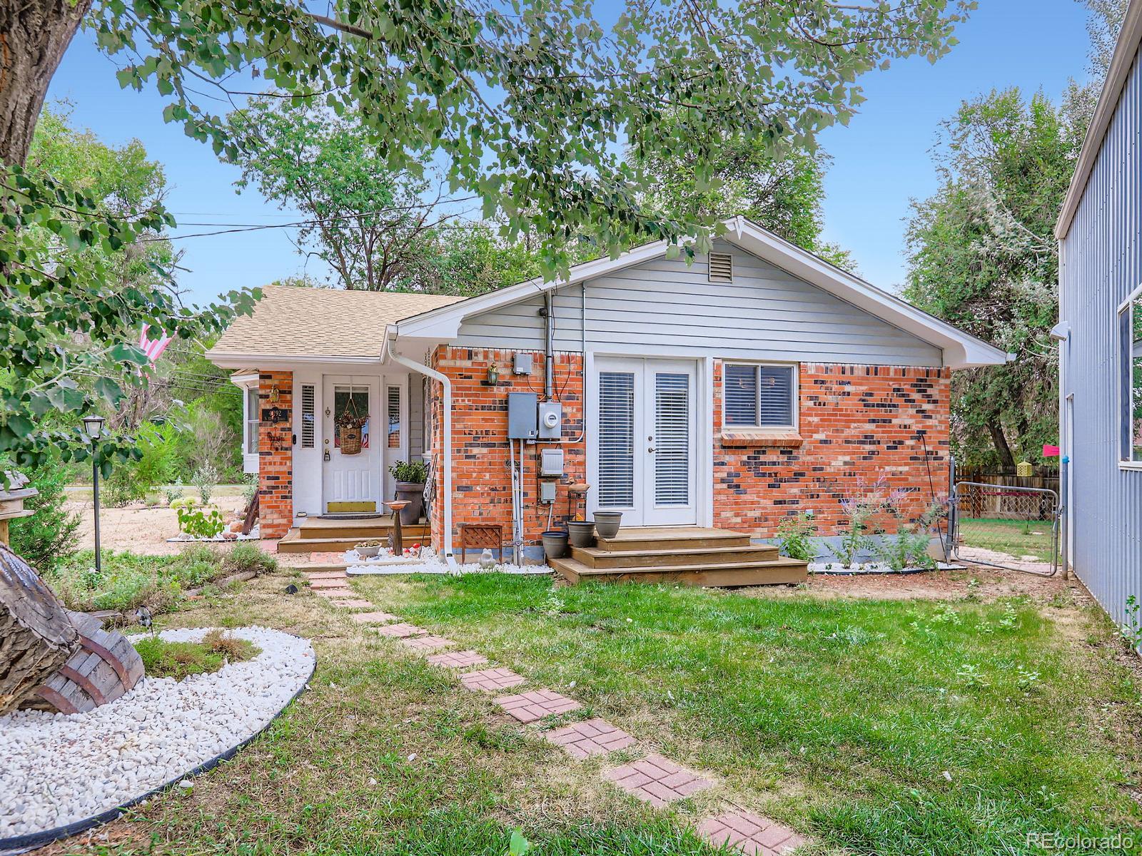 4292 North 119th Street Erie, CO 80516 - Photo 2 of 30 front view of a house with a yard