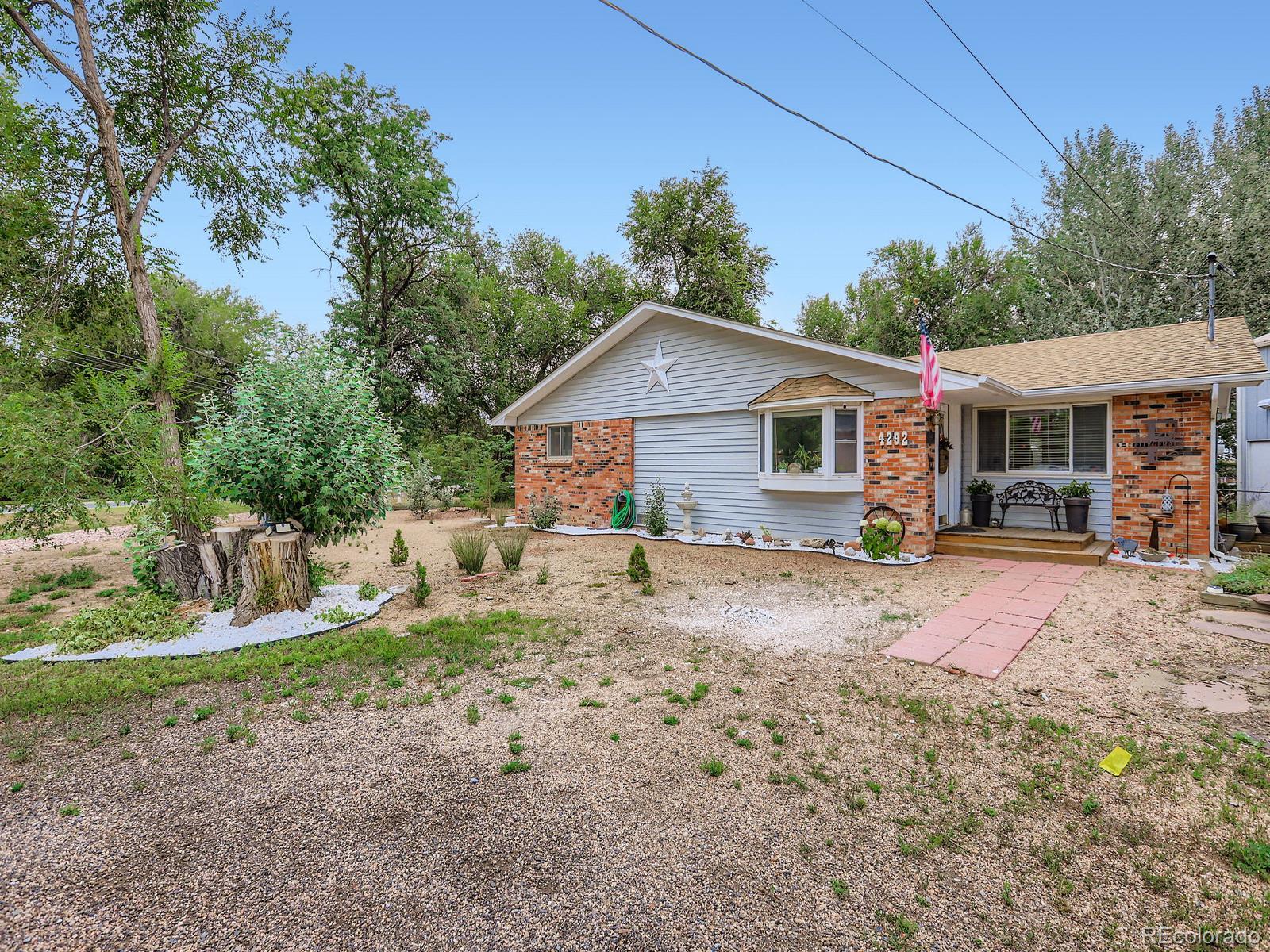 4292 North 119th Street Erie, CO 80516 - Photo 22 of 30 a view of a house with backyard and sitting area