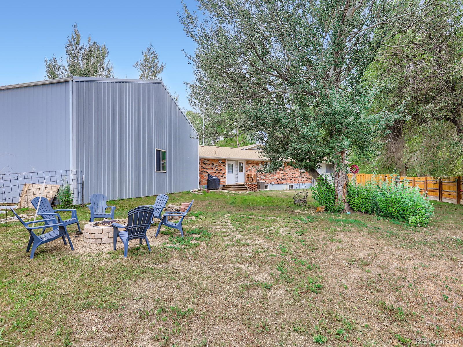 4292 North 119th Street Erie, CO 80516 - Photo 24 of 30 a view of backyard with outdoor seating and green space