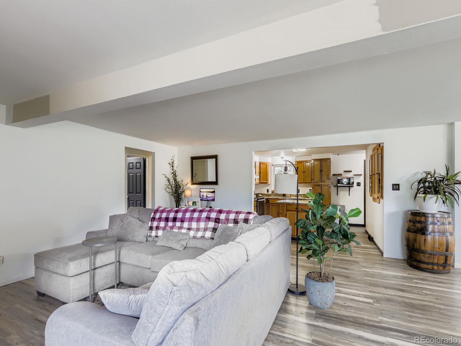 4292 North 119th Street Erie, CO 80516 - Photo 8 of 30 a living room with furniture and wooden floor