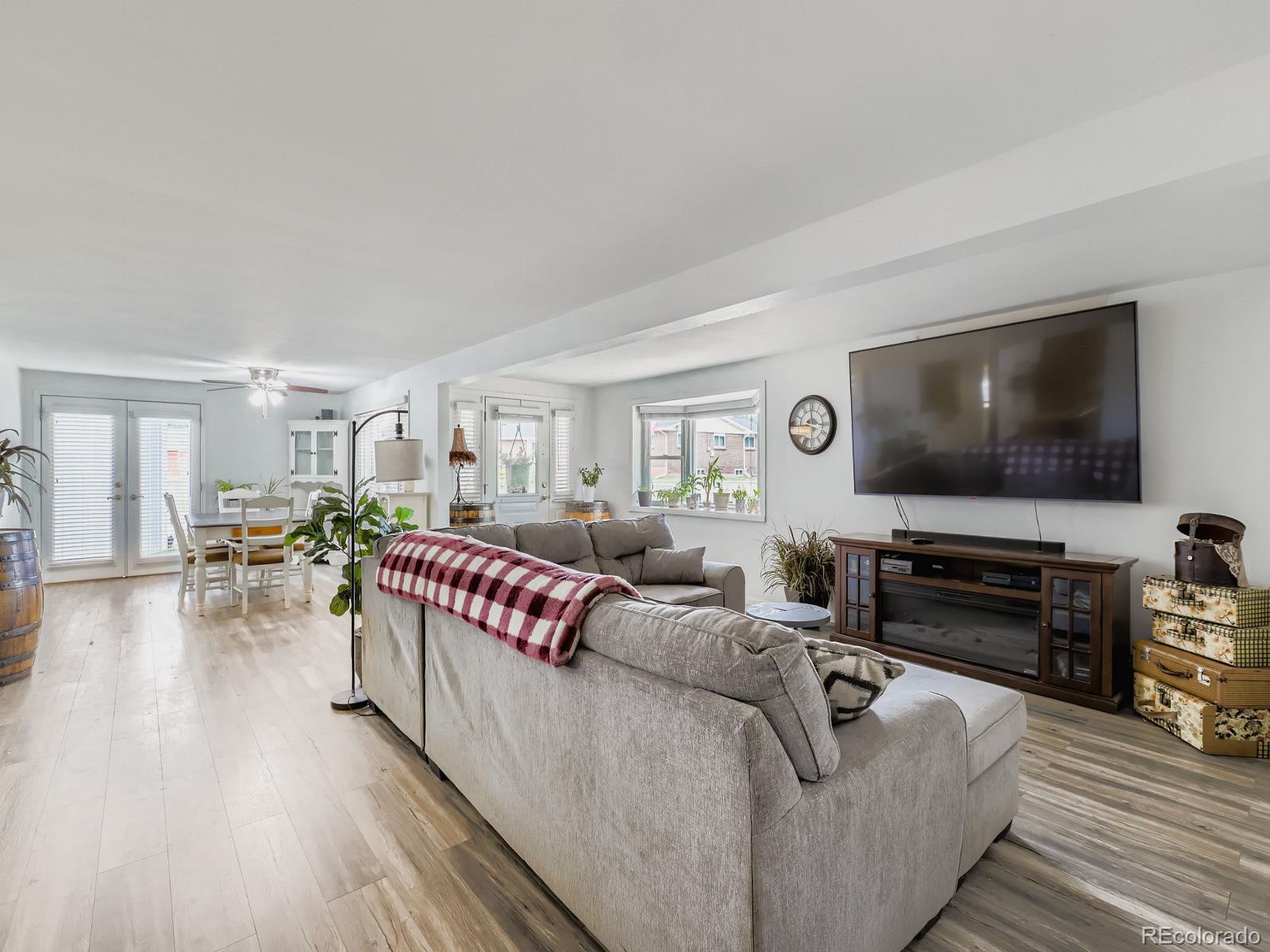 4292 North 119th Street Erie, CO 80516 - Photo 10 of 30 a living room with furniture and a flat screen tv