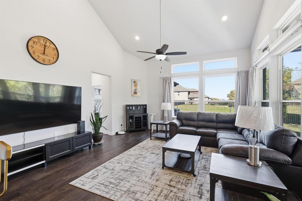 1988 Nottingham Place Allen, TX 75013 - Photo 16 of 40 Living room with high vaulted ceiling, recessed lighting, dark wood-style floors, and a ceiling fan
