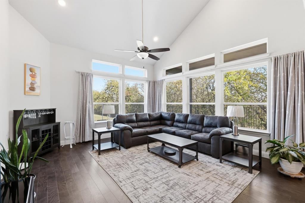 1988 Nottingham Place Allen, TX 75013 - Photo 18 of 40 Living room with high vaulted ceiling, wood-type flooring, recessed lighting, and a ceiling fan