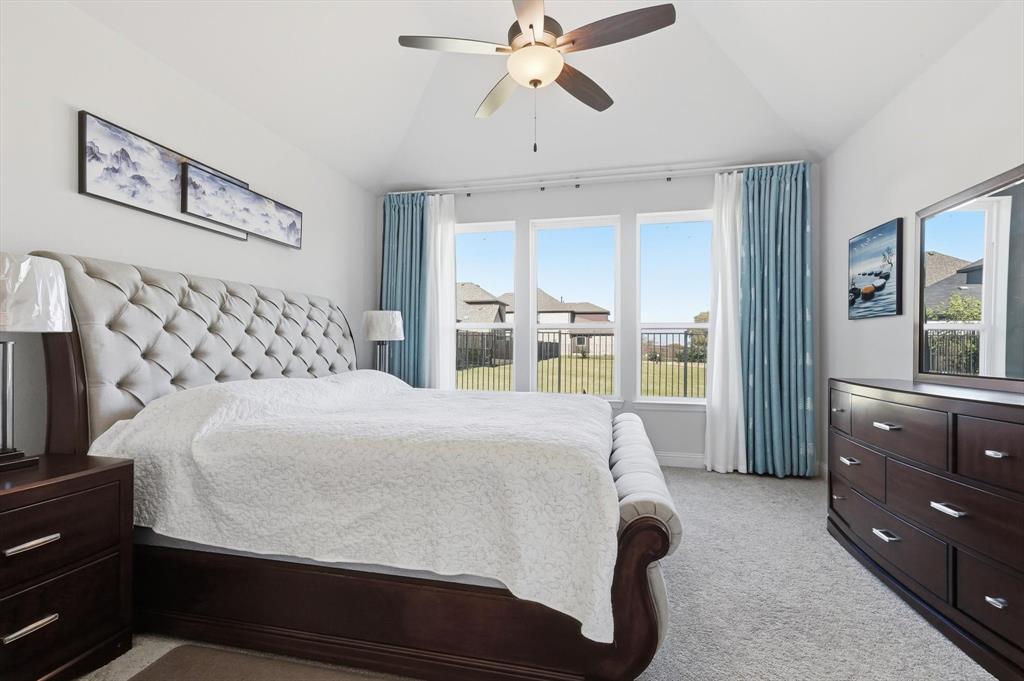 1988 Nottingham Place Allen, TX 75013 - Photo 20 of 40 Bedroom with light carpet, lofted ceiling, and ceiling fan