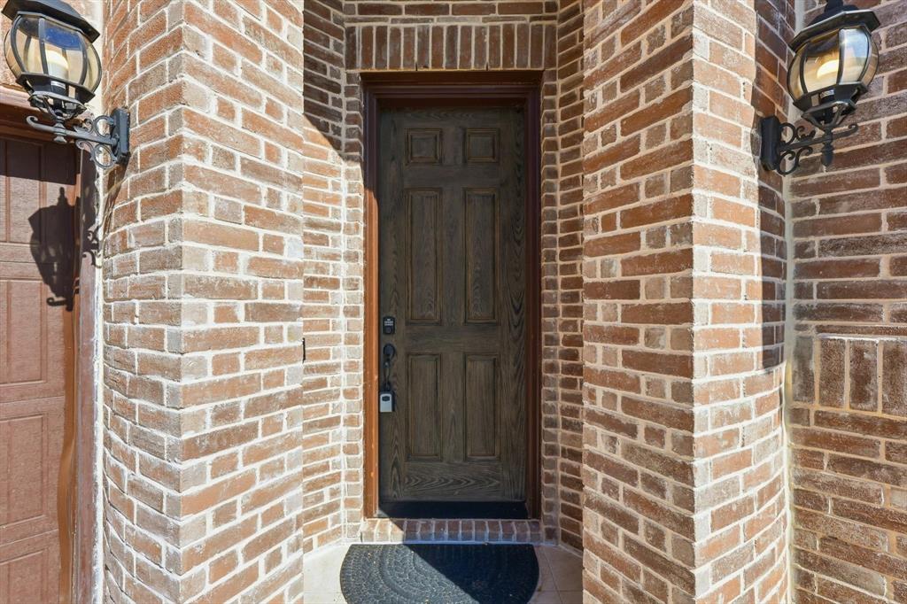 1988 Nottingham Place Allen, TX 75013 - Photo 3 of 40 Property entrance featuring brick siding
