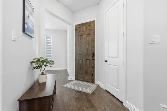 a view of room with window and wooden floor