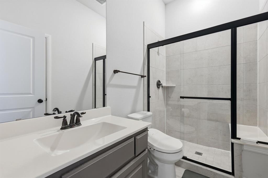 1988 Nottingham Place Allen, TX 75013 - Photo 9 of 40 Full bath with vanity and a shower stall