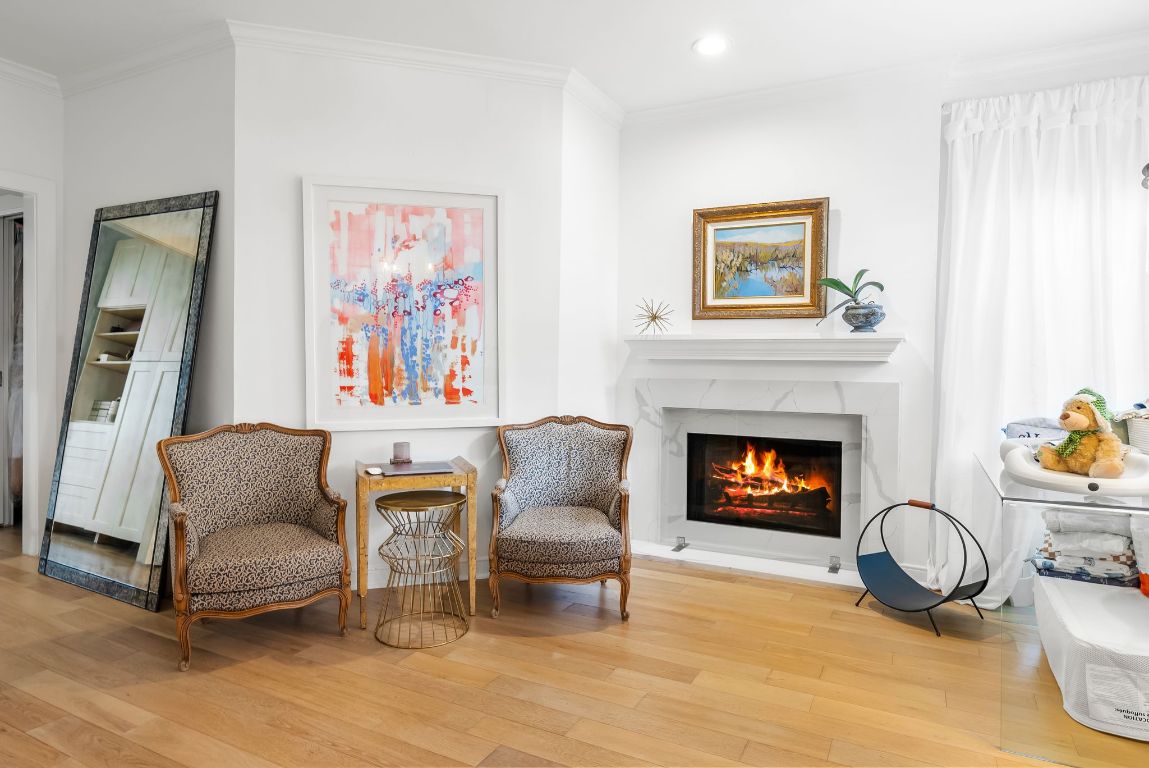 1937 Rue De St Tropez, Unit 10 Austin, TX 78746 - Photo 12 of 35 a living room with furniture and a fireplace
