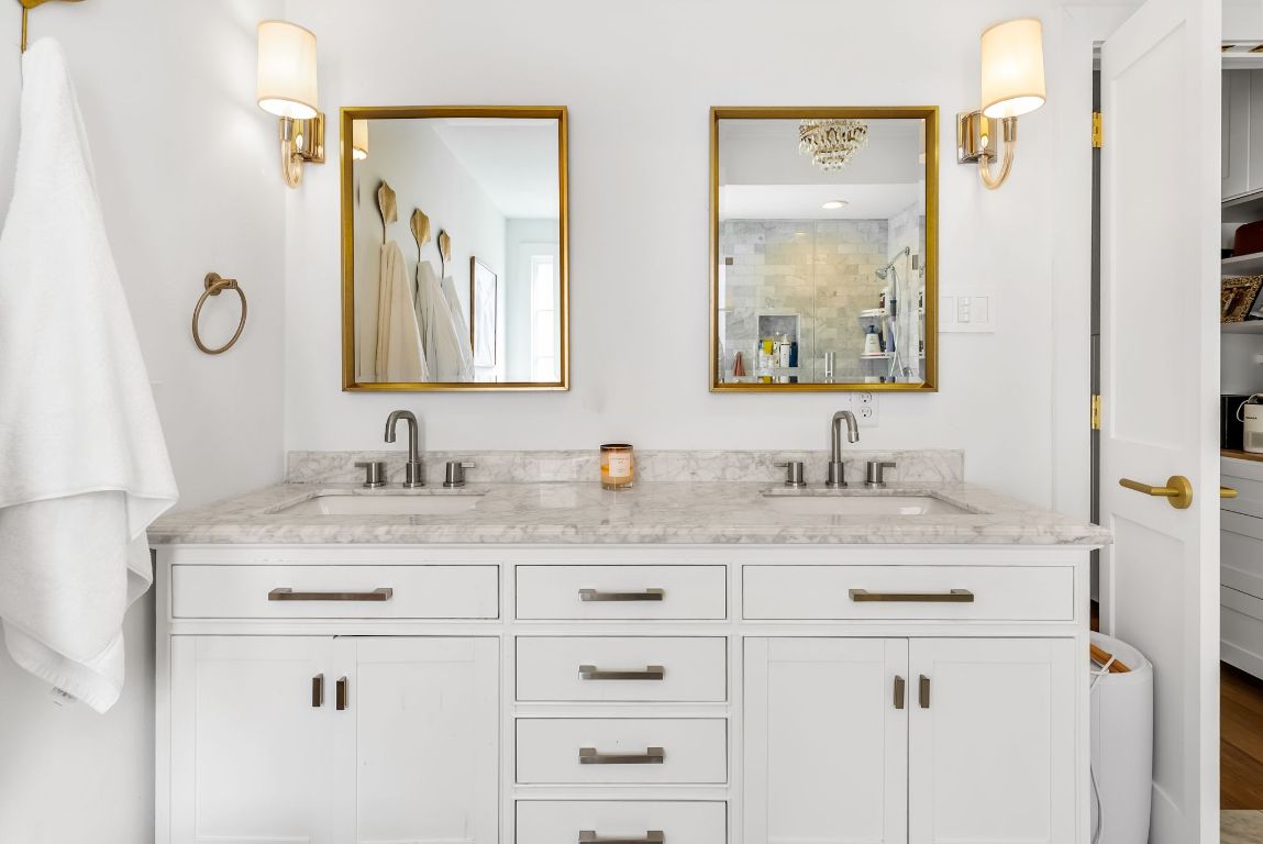 1937 Rue De St Tropez, Unit 10 Austin, TX 78746 - Photo 15 of 35 a bathroom with double sink and a mirror