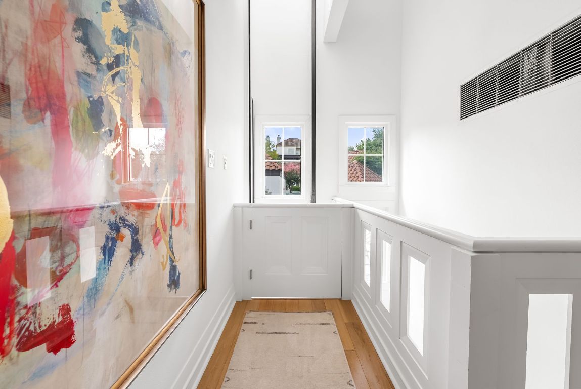 1937 Rue De St Tropez, Unit 10 Austin, TX 78746 - Photo 16 of 35 a view of a bathroom with a window and a shower curtain