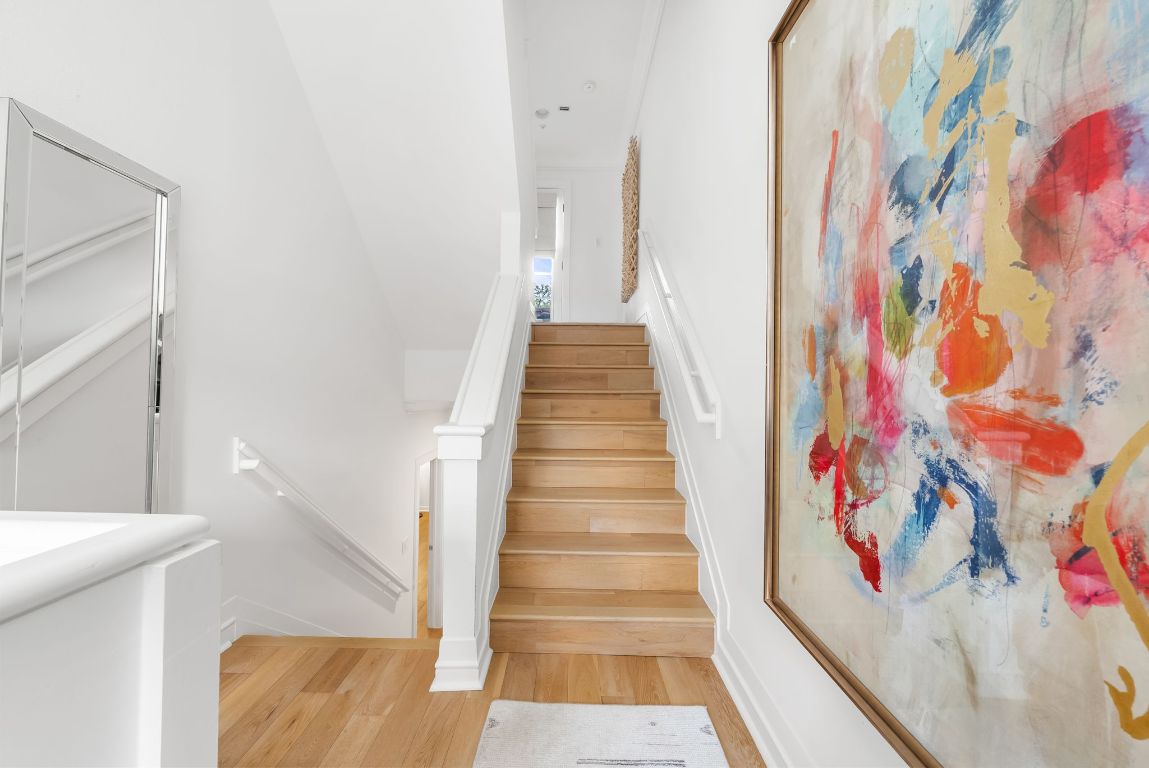 1937 Rue De St Tropez, Unit 10 Austin, TX 78746 - Photo 17 of 35 a view of a hallway with wooden floor and entryway