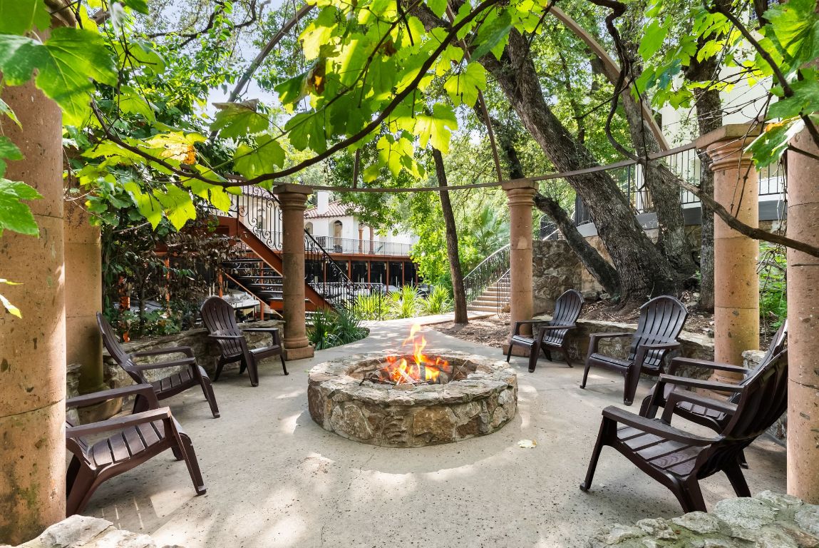 1937 Rue De St Tropez, Unit 10 Austin, TX 78746 - Photo 26 of 35 a view of a backyard with sitting area and furniture