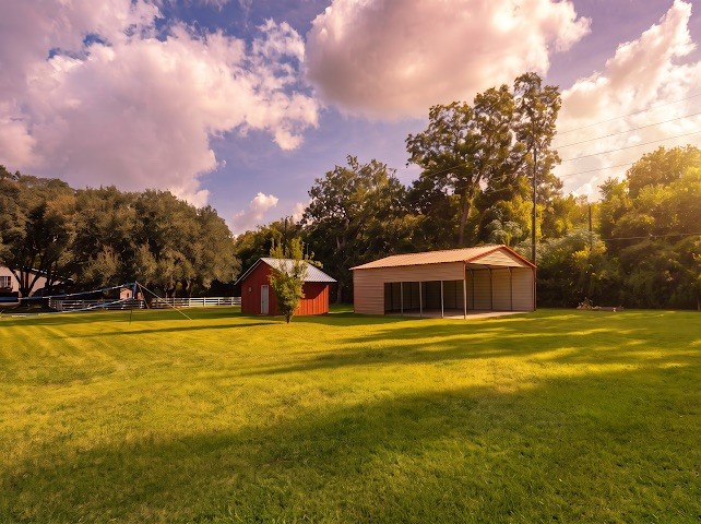1114 Wagon Road Simonton, TX 77485 - Photo 8 of 48 Expansive lawn surrounded by lush trees!