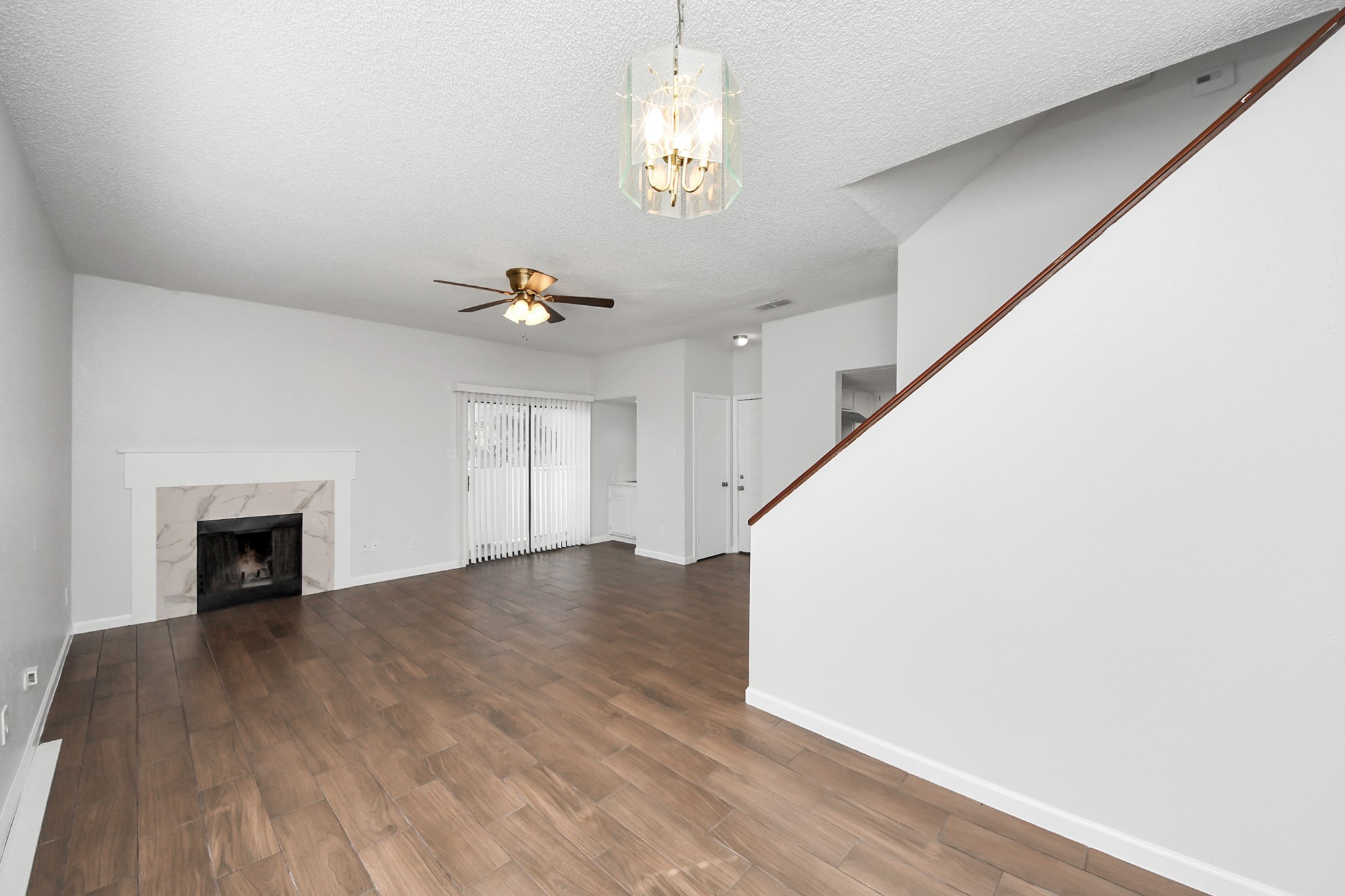 3750 Tanglewilde Street, Unit A7 Houston, TX 77063 - Photo 12 of 36 a view of an empty room with wooden floor and a window
