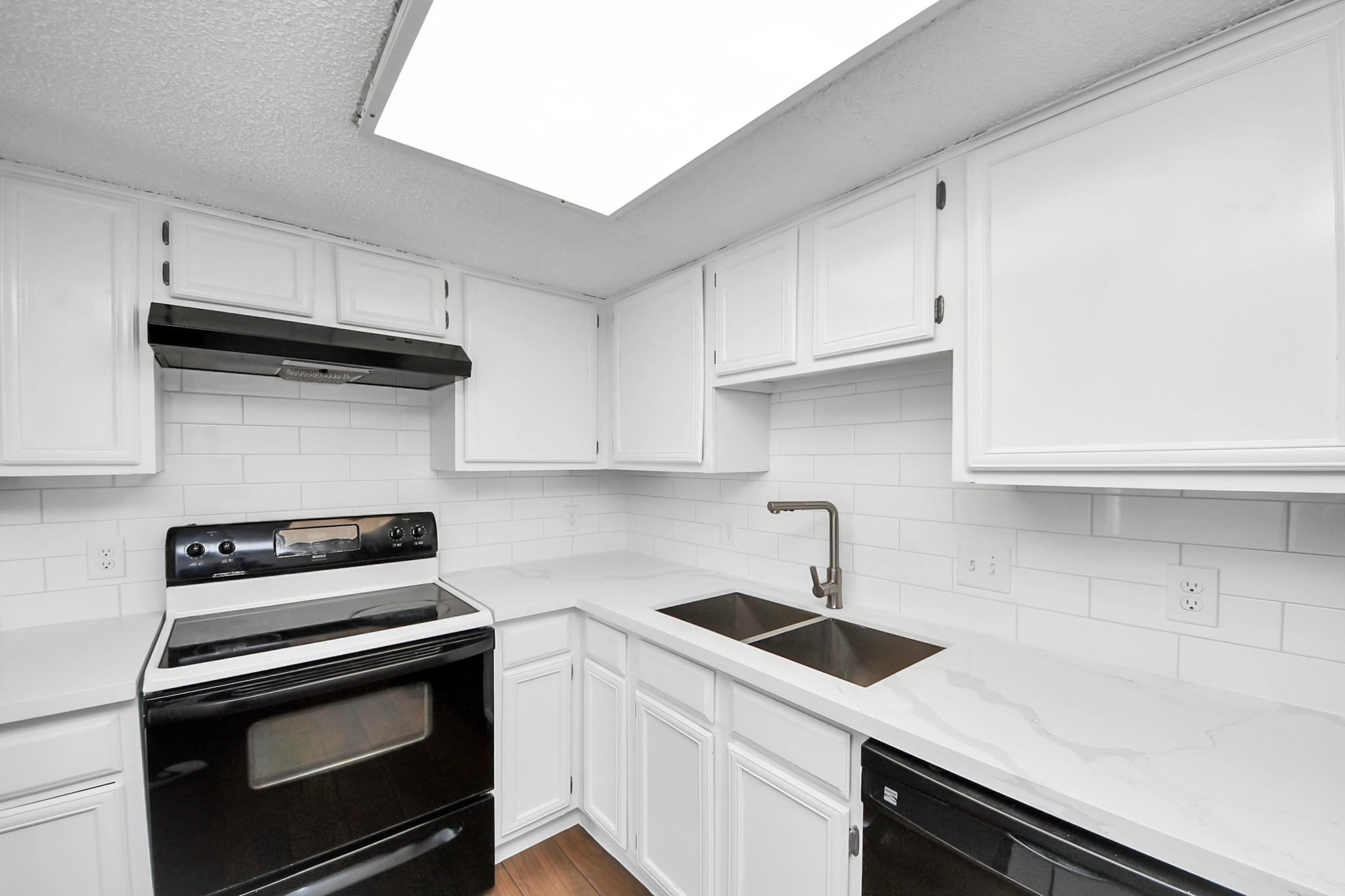 3750 Tanglewilde Street, Unit A7 Houston, TX 77063 - Photo 17 of 36 a kitchen with granite countertop a stove sink and cabinets