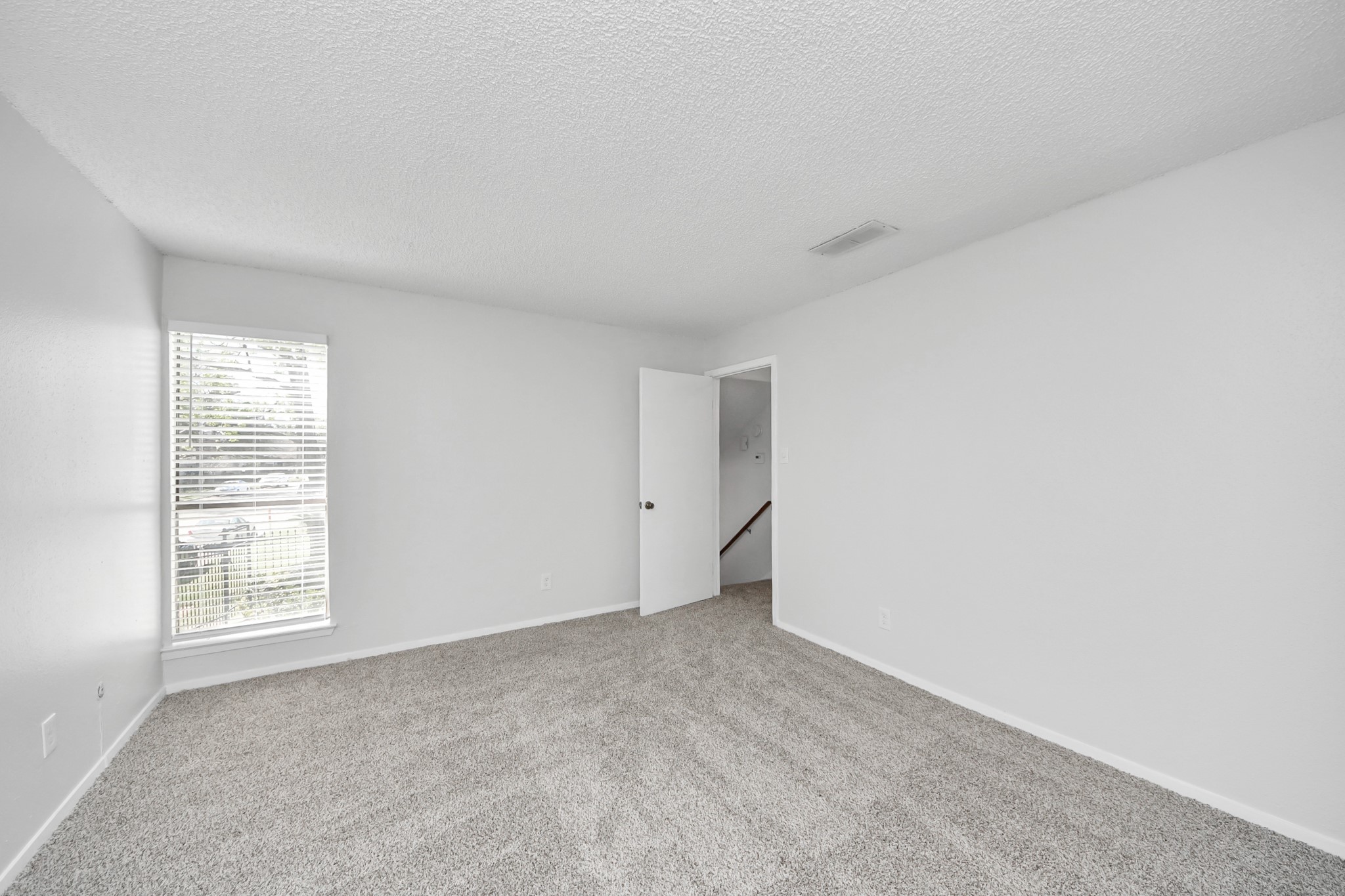 3750 Tanglewilde Street, Unit A7 Houston, TX 77063 - Photo 18 of 36 an empty room with windows