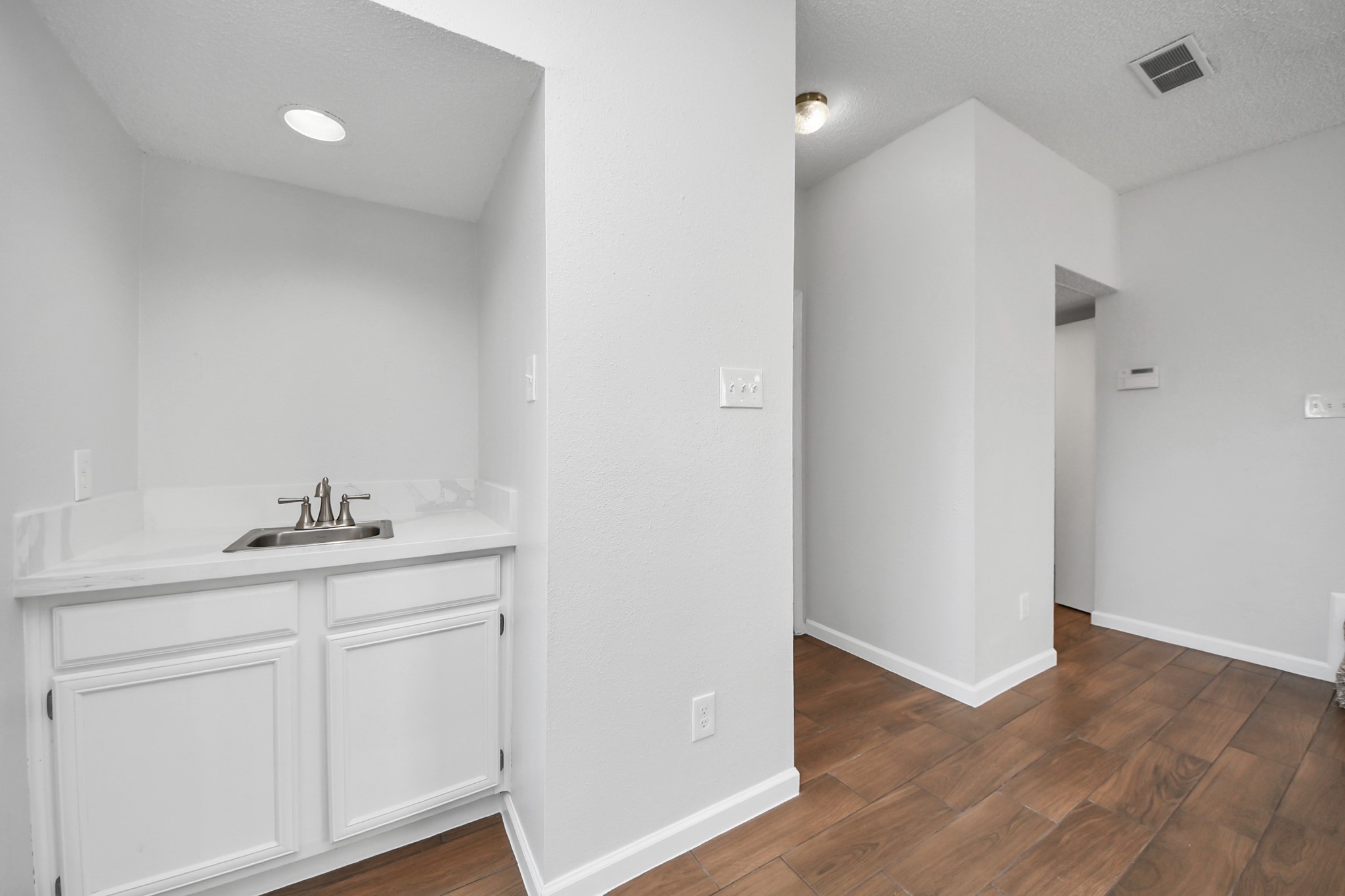 3750 Tanglewilde Street, Unit A7 Houston, TX 77063 - Photo 9 of 36 a view of cabinets and wooden floor