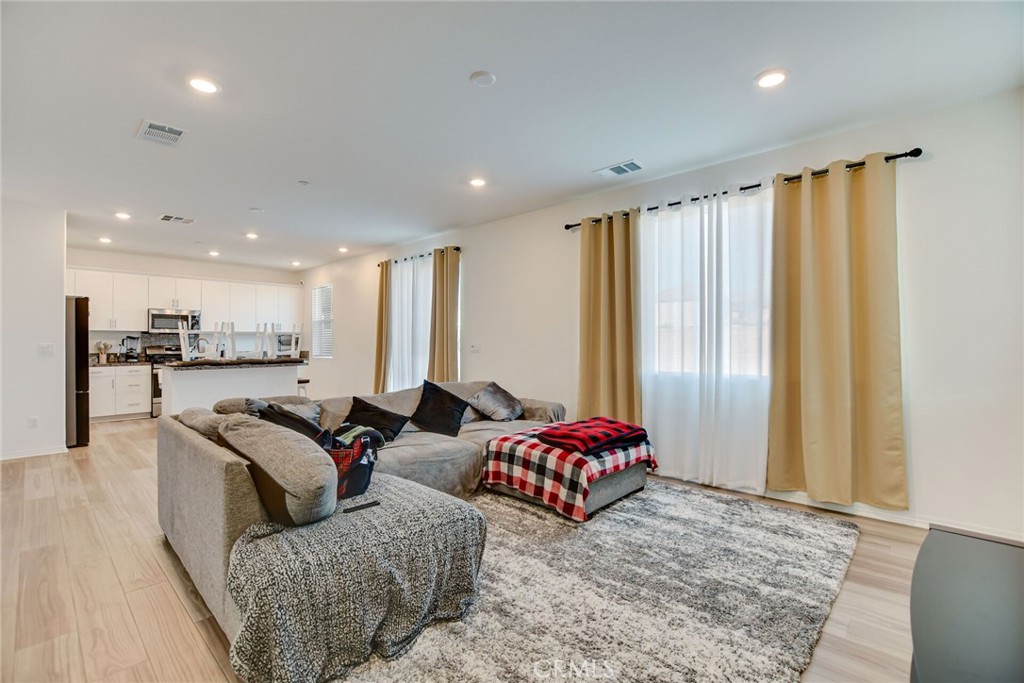 2526 Gunner Ridge Way Rialto, CA 92377 - Photo 11 of 33 a living room with furniture and a large window