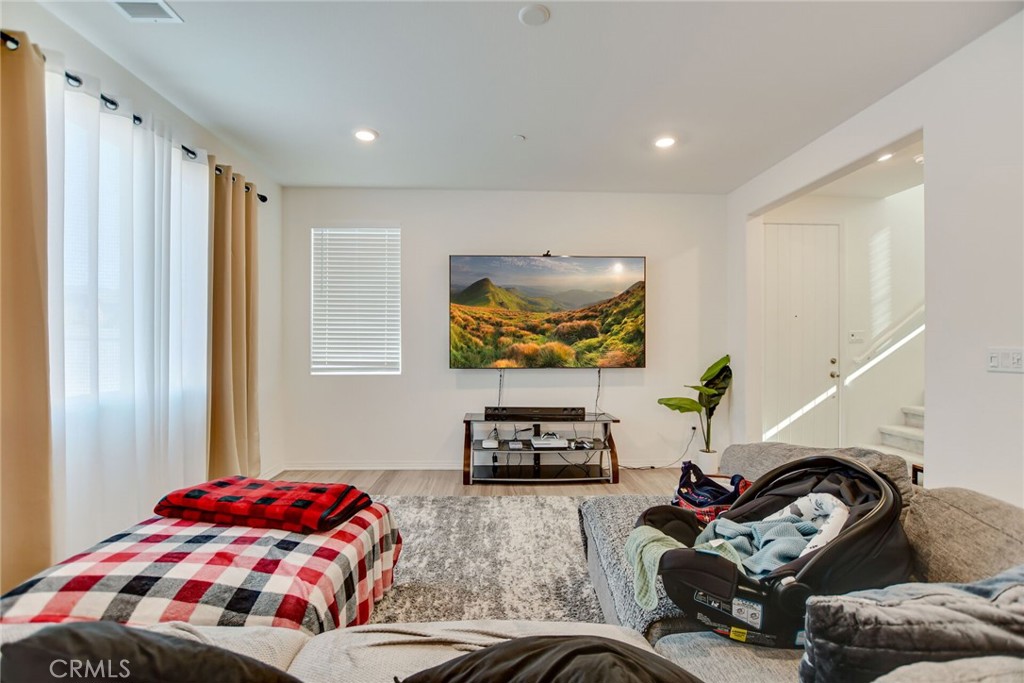 2526 Gunner Ridge Way Rialto, CA 92377 - Photo 8 of 33 a bedroom with bed and a couch