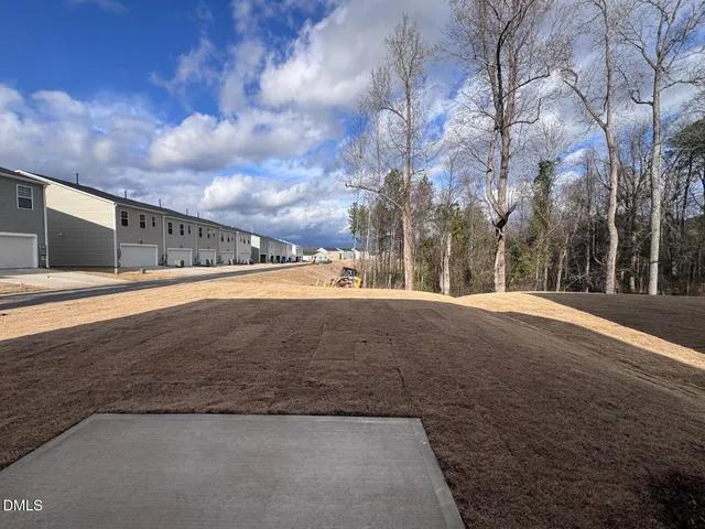 a view of an empty room with a fireplace