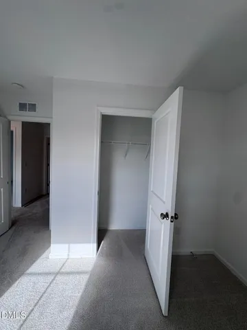 a bathroom with a granite countertop toilet a sink and shower