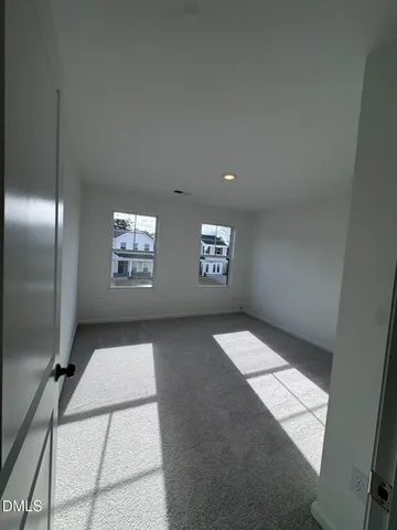 a bathroom with a sink toilet vanity and mirror