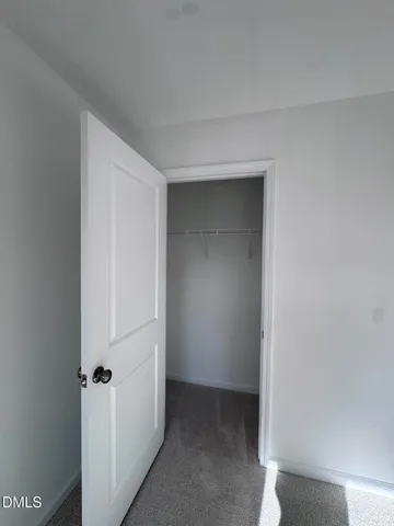 an empty room with a empty space and a window