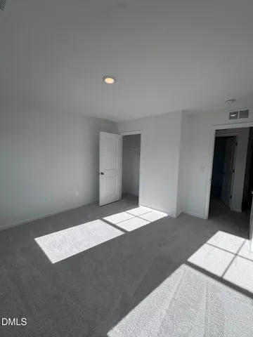 a view of empty room with windows