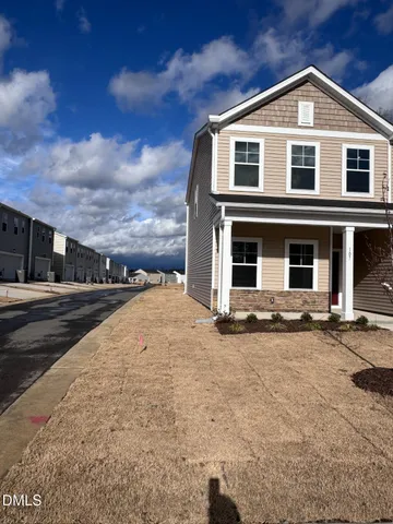a front view of a house with yard