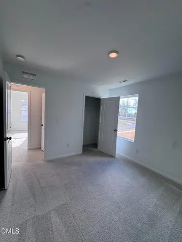 a bathroom with a double vanity sink and mirror