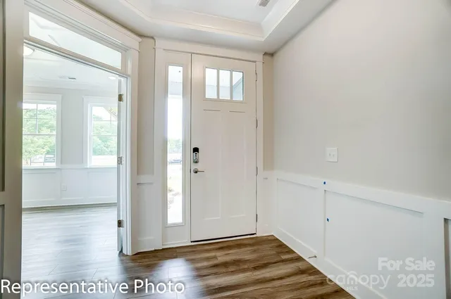 a view of livingroom with hardwood floor and hallway