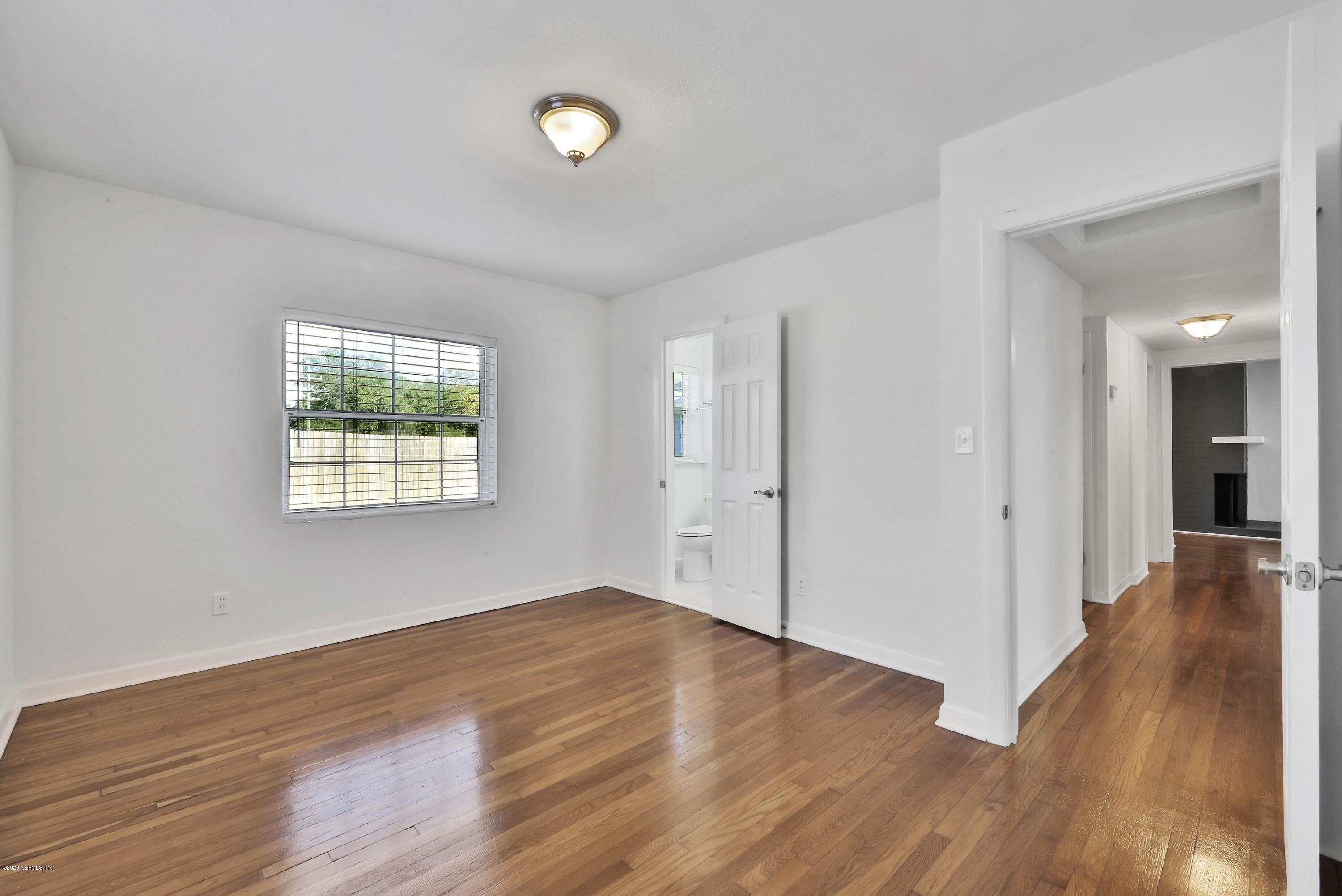 1705 Furman Road Jacksonville, FL 32217 - Photo 12 of 23 wooden floor in an empty room with a window