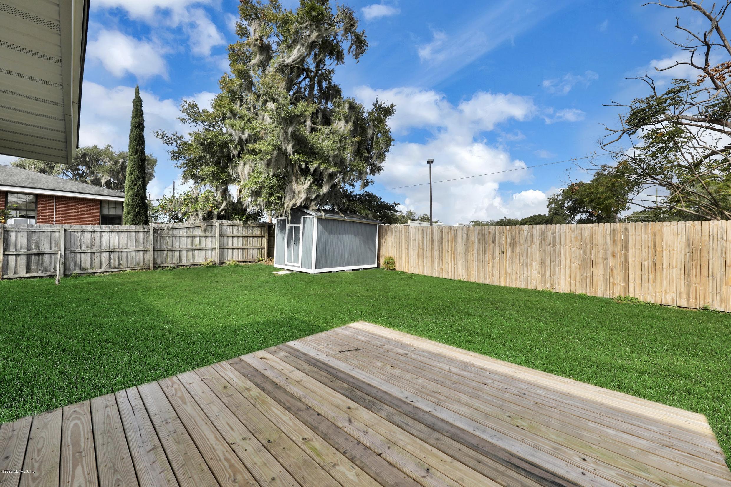 1705 Furman Road Jacksonville, FL 32217 - Photo 21 of 23 a view of a backyard with sitting area