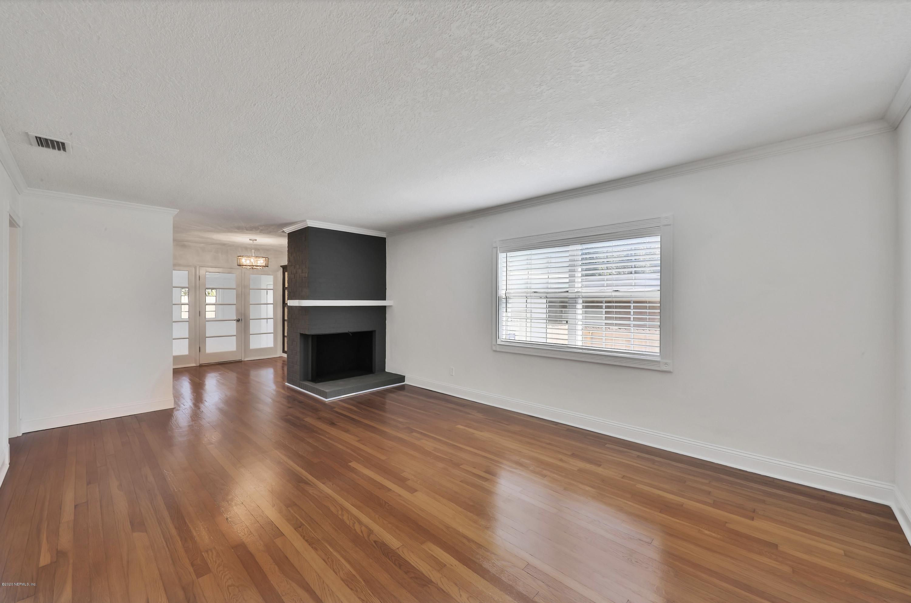 1705 Furman Road Jacksonville, FL 32217 - Photo 4 of 23 wooden floor in an empty room with a window