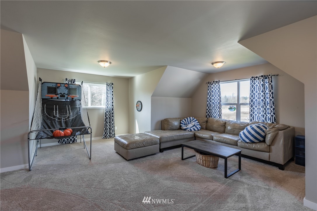 3223 Brown Road Ferndale, WA 98248 - Photo 14 of 40 a living room with furniture and a flat screen tv