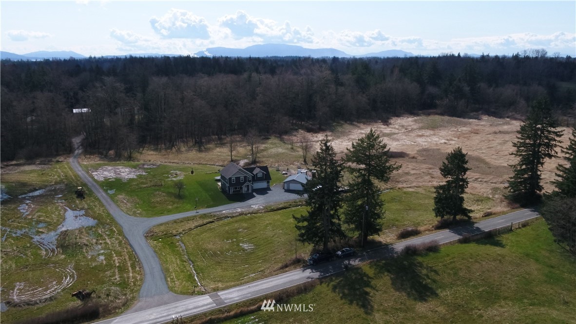 3223 Brown Road Ferndale, WA 98248 - Photo 36 of 40 a view of a lake with a yard