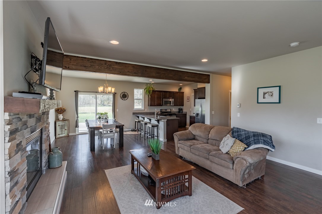 3223 Brown Road Ferndale, WA 98248 - Photo 5 of 40 a living room with furniture and a flat screen tv
