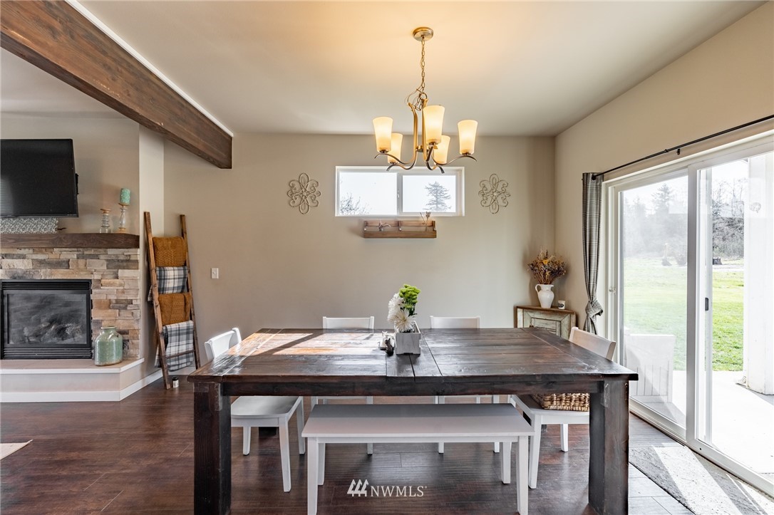 3223 Brown Road Ferndale, WA 98248 - Photo 9 of 40 a view of a dining room with a table and chairs