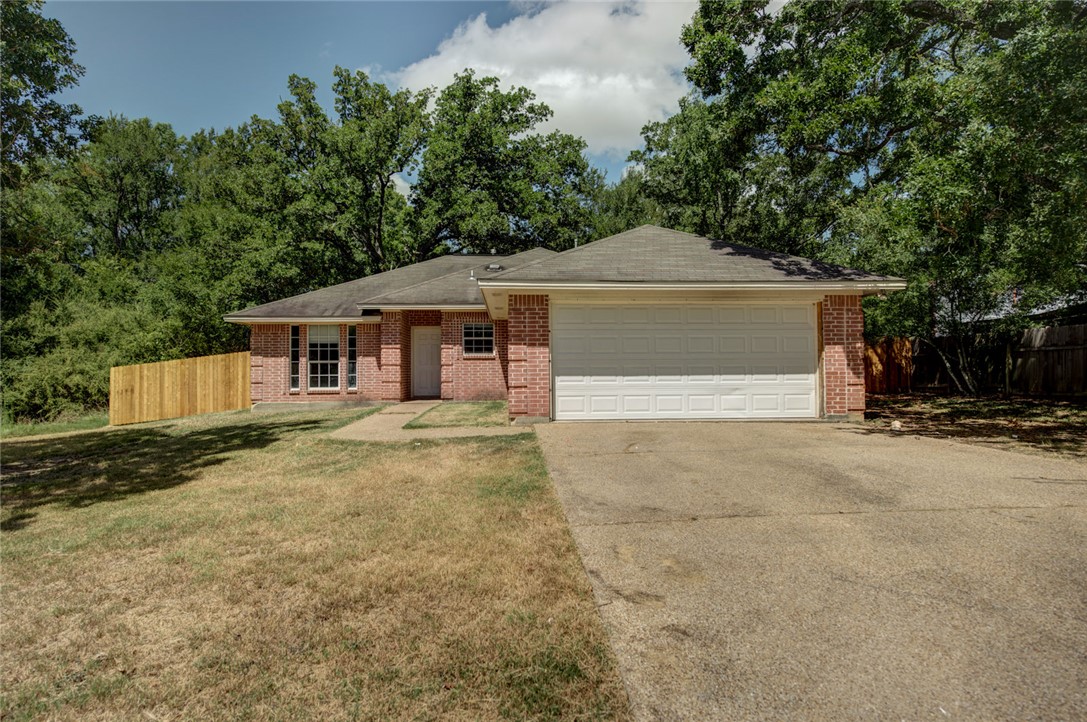 2402 Jaguar Court Bryan, TX 77807 - Photo 1 of 19 a front view of a house with a yard and garage