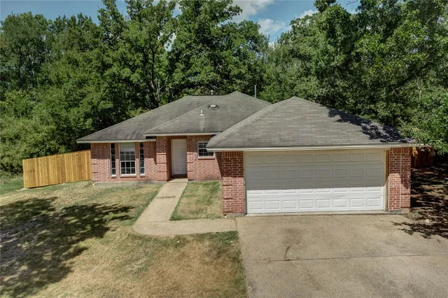 a house with trees in the background