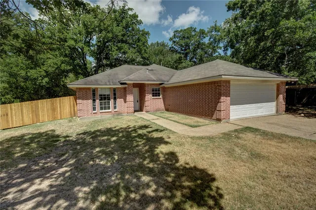 a house with trees in the background