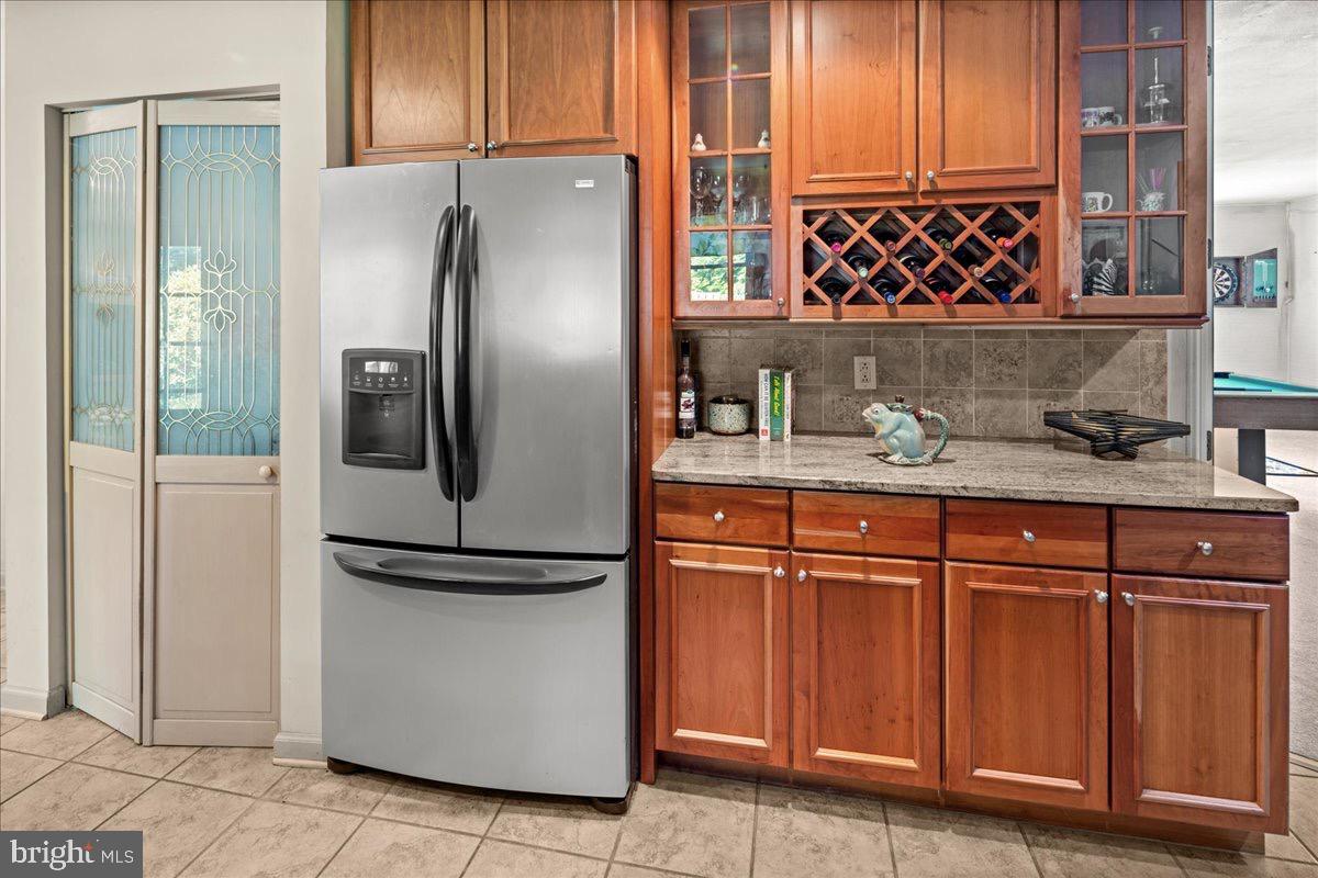 20 Bernard Drive Ewing, NJ 08628 - Photo 11 of 44 a kitchen with stainless steel appliances granite countertop a refrigerator and a sink