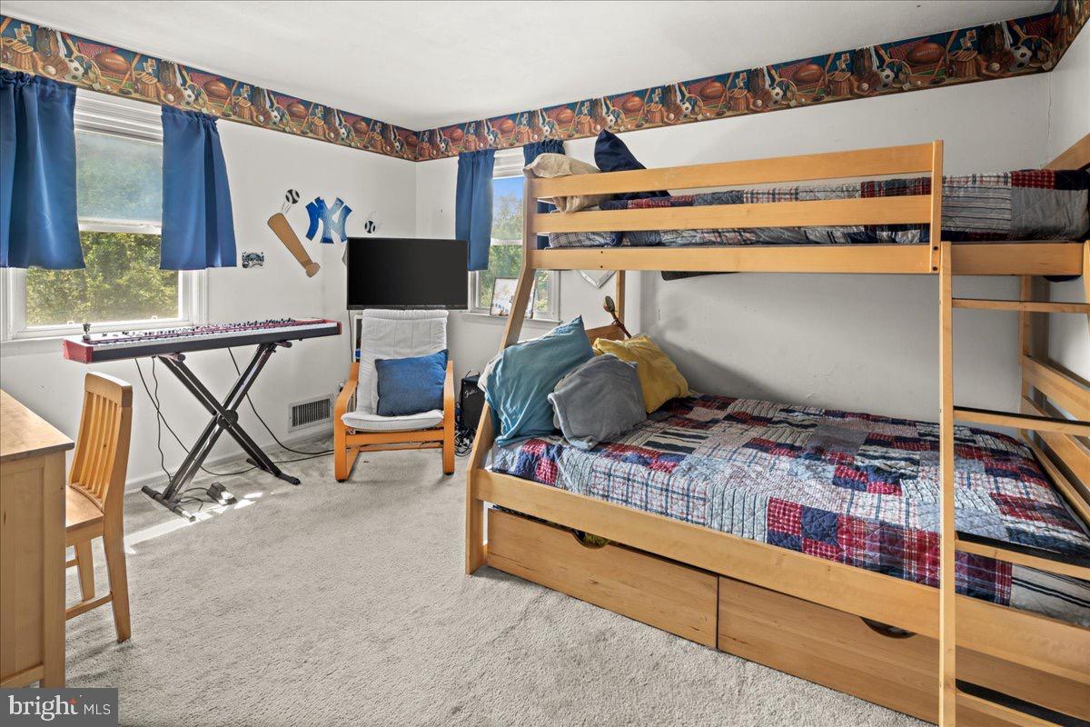 20 Bernard Drive Ewing, NJ 08628 - Photo 21 of 44 a bedroom with bunk bed and a window