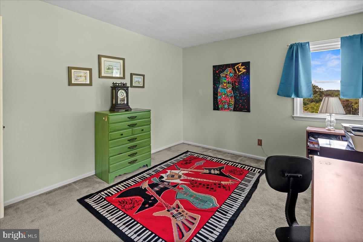 20 Bernard Drive Ewing, NJ 08628 - Photo 23 of 44 a bedroom with a bed and a chair