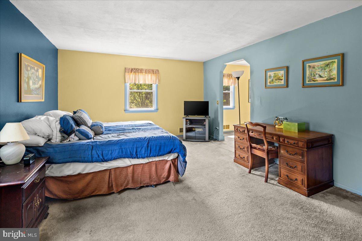 20 Bernard Drive Ewing, NJ 08628 - Photo 27 of 44 a bedroom with bed and wooden floor