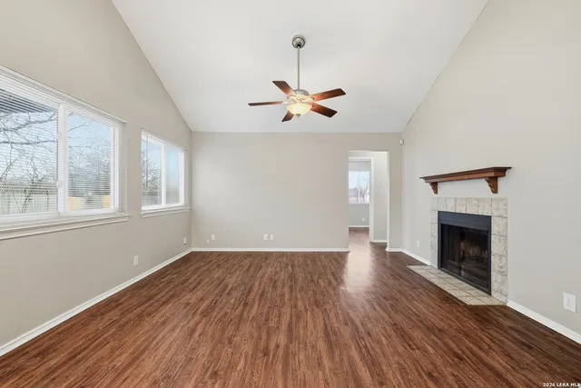 wooden floor in an empty room with a window